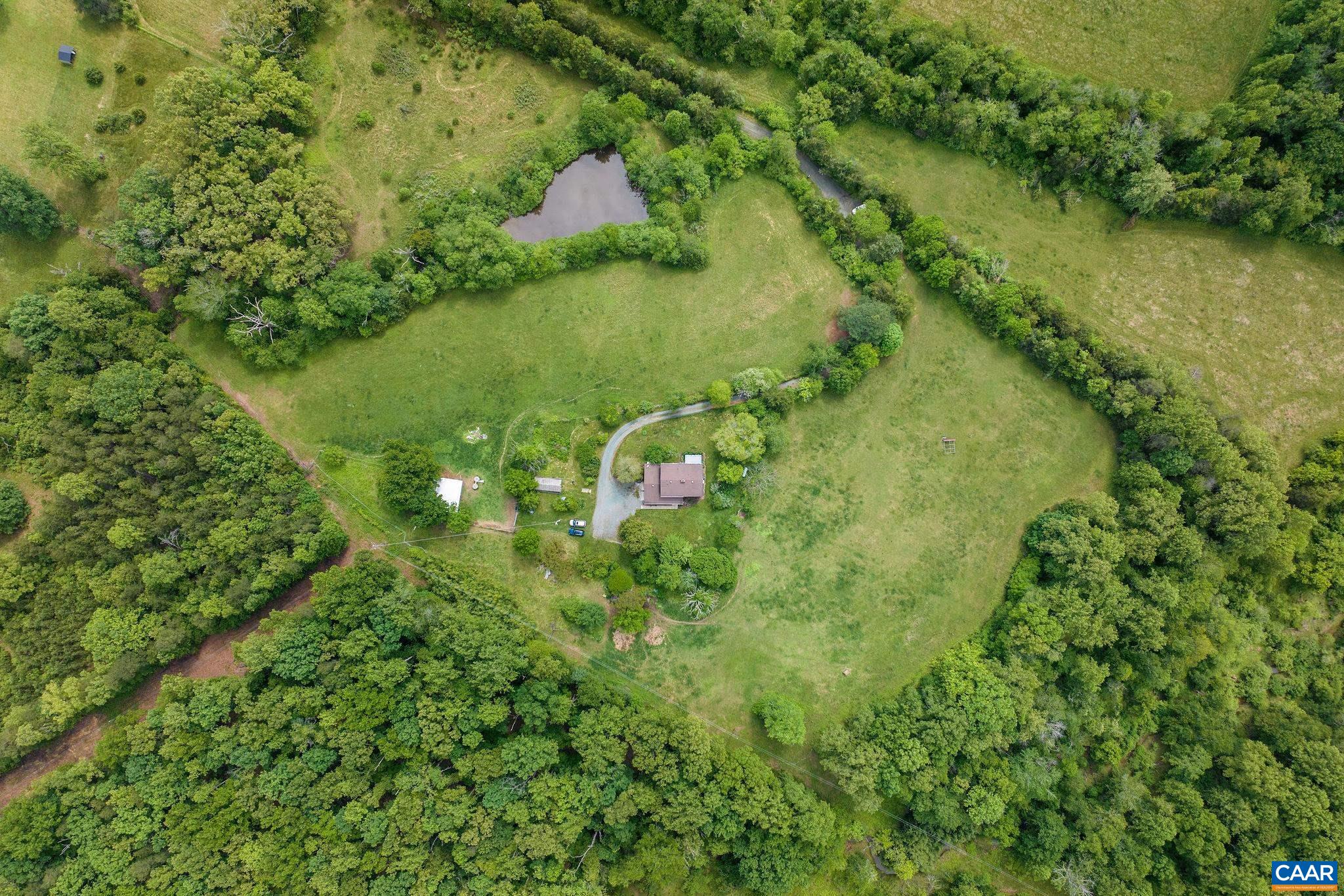 1701 Harrington Road Gordonsville, VA 22942 - Photo 3 of 28 a view of a lake with a yard