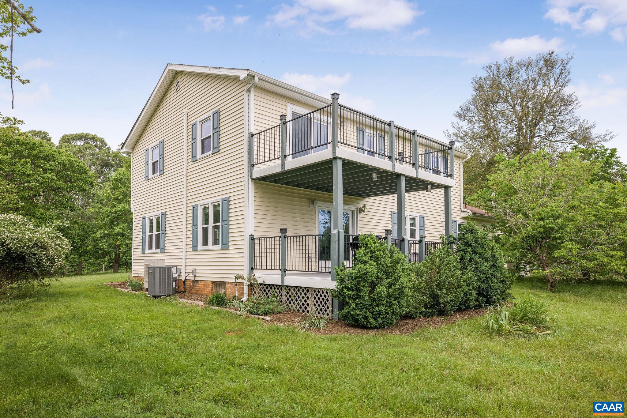 1701 Harrington Road Gordonsville, VA 22942 - Photo 7 of 28 a front view of a house with a yard