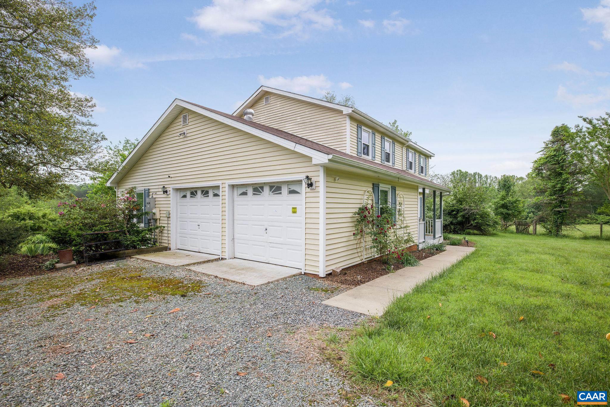 1701 Harrington Road Gordonsville, VA 22942 - Photo 8 of 28 a view of a house with backyard and garden