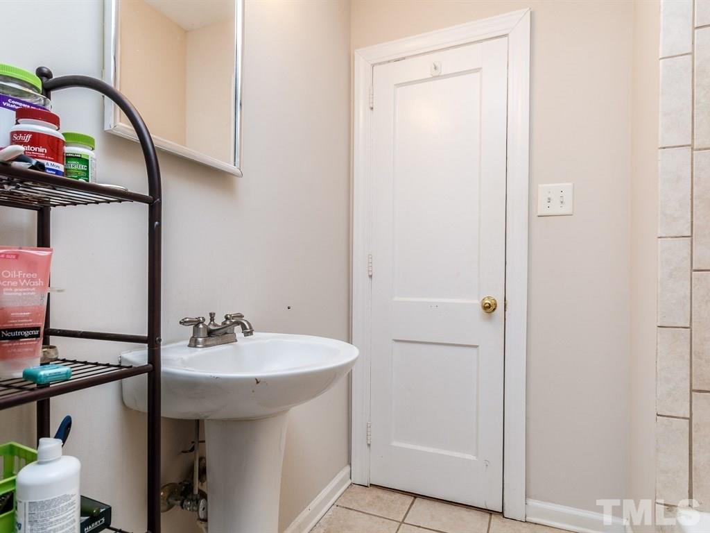 1204 Brooks Avenue Raleigh, NC 27607 - Photo 14 of 25 a bathroom with a sink and a mirror