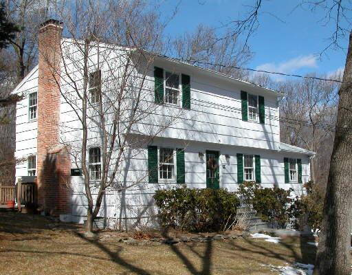 94 Castle Hill Road Newtown, CT 06470 - Photo 1 of 1 a front view of a house with garden