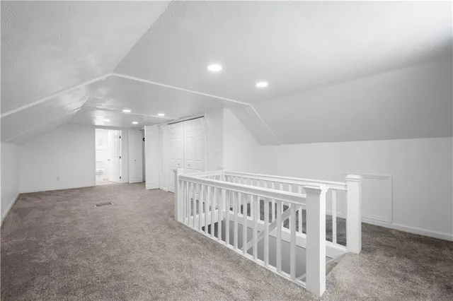 a view of an empty room with windows