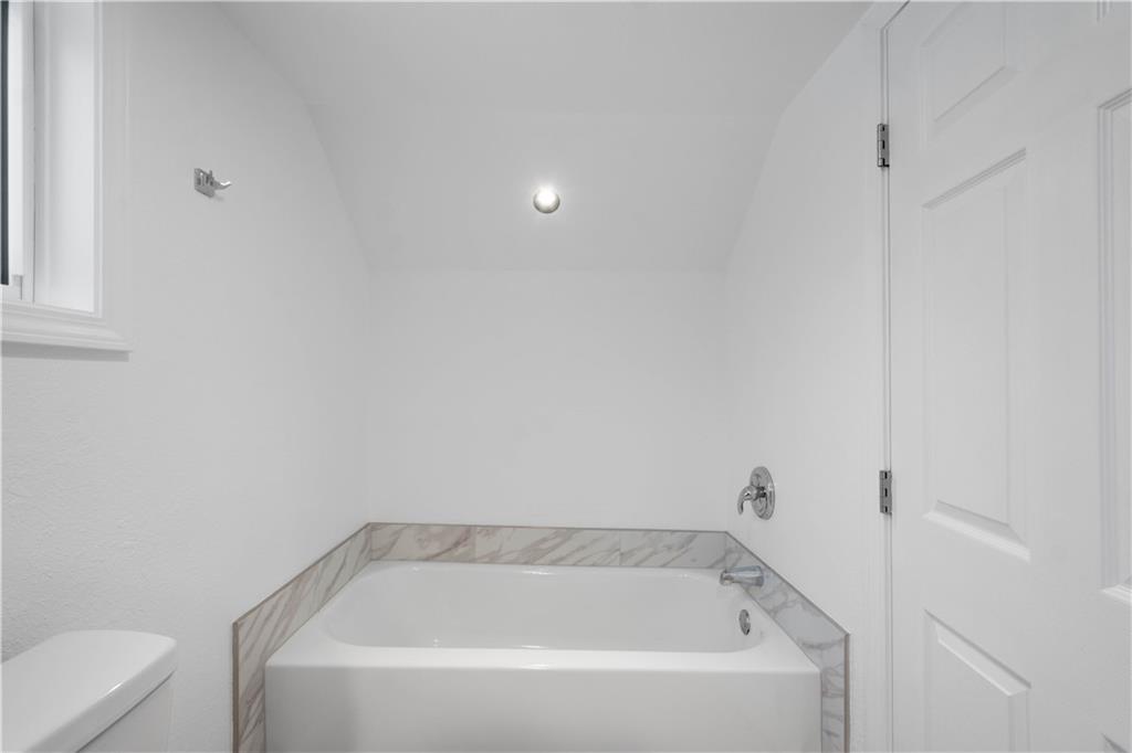 30 Evans Road Charleroi, PA 15022 - Photo 27 of 34 a white bath tub sitting next to a white toilet