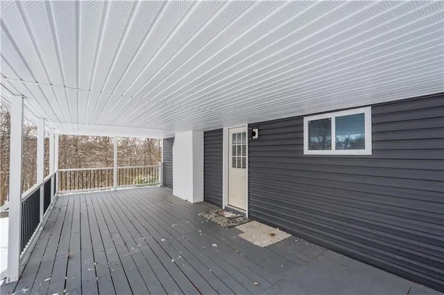 a view of a house with wooden floor and a window