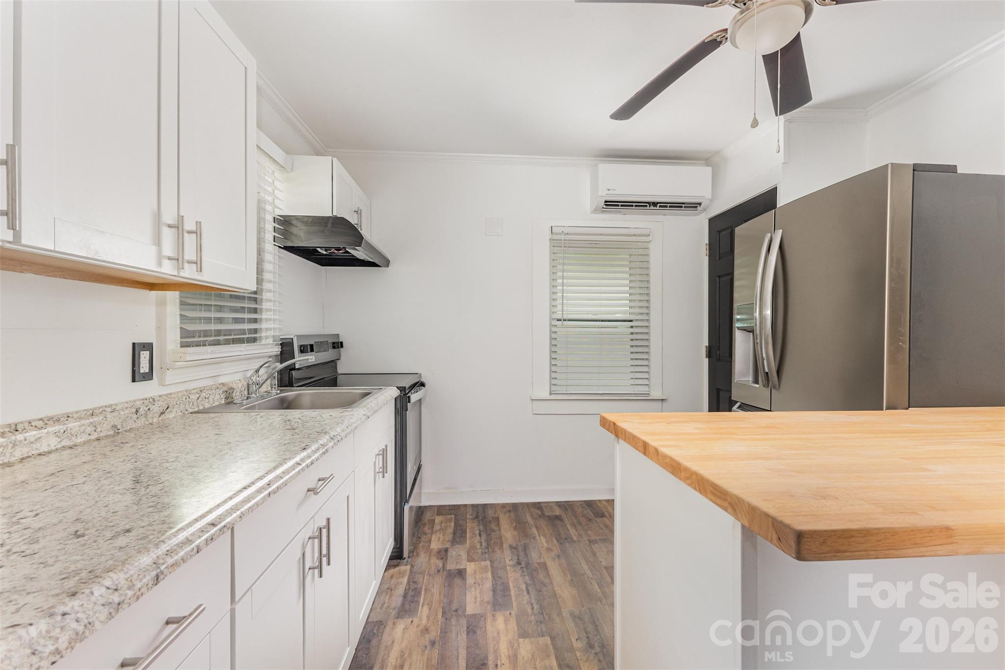 664 Simpson Street Rock Hill, SC 29730 - Photo 5 of 23 a kitchen with stainless steel appliances granite countertop a sink a stove and a refrigerator