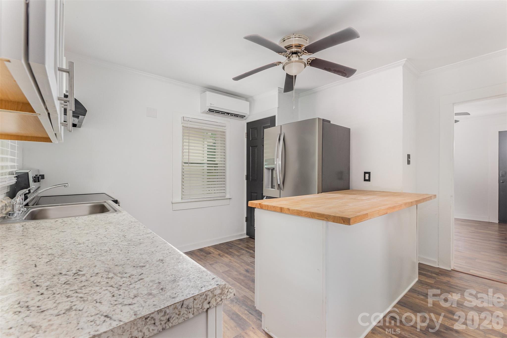 664 Simpson Street Rock Hill, SC 29730 - Photo 7 of 23 a view of a kitchen with a sink and a refrigerator