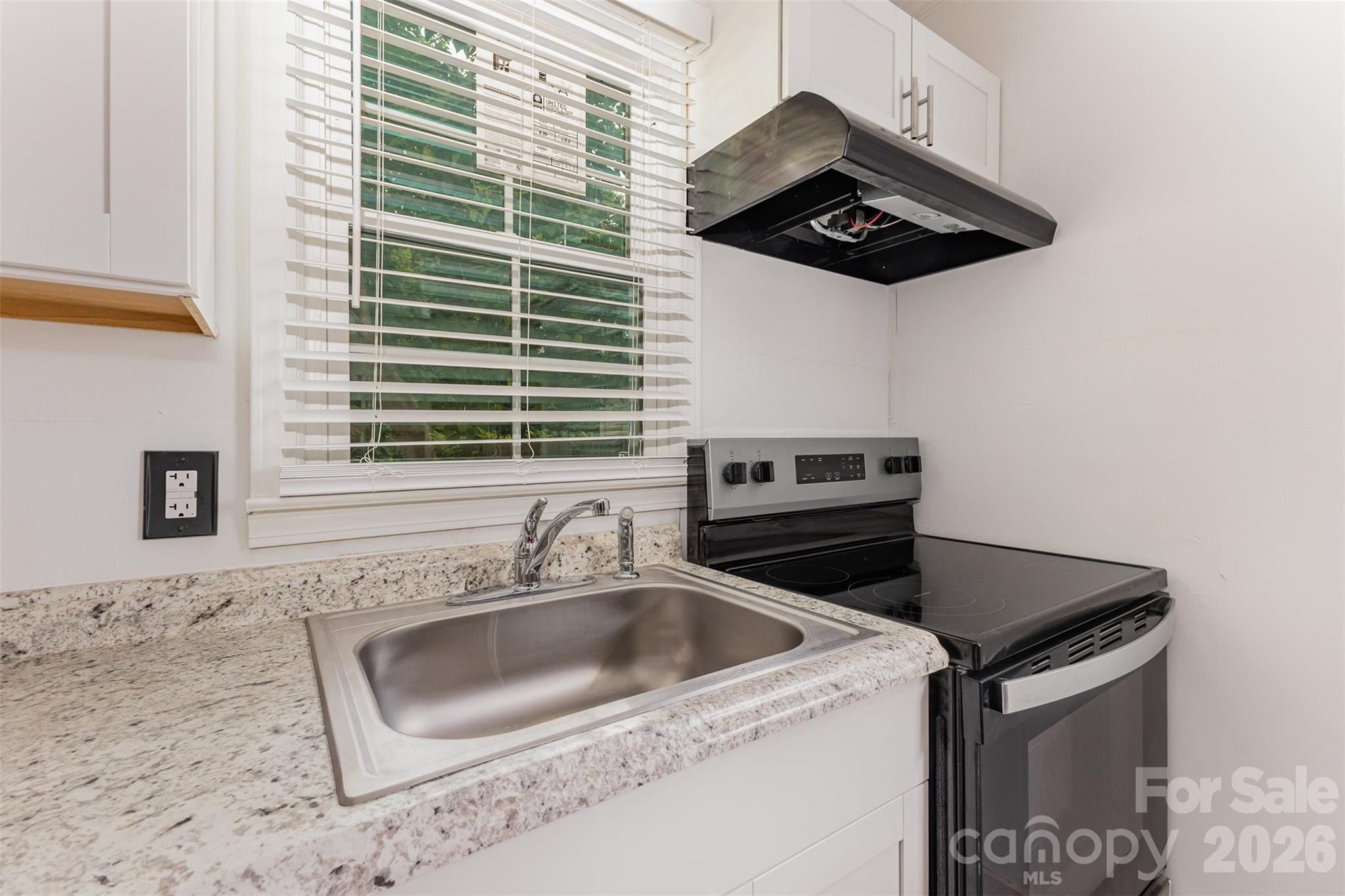 664 Simpson Street Rock Hill, SC 29730 - Photo 8 of 23 a kitchen that has a sink and a stove