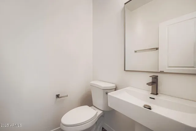 a large kitchen with lot of counter space and wooden floor