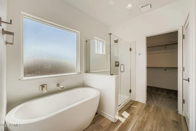a bathroom with a bathtub and a shower