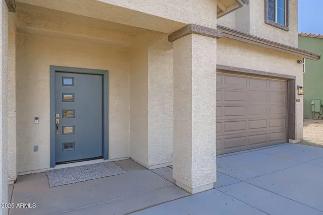a view of front door and a glass door