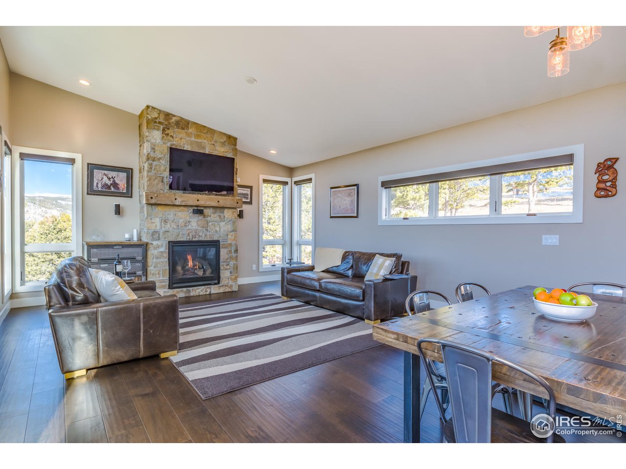 21 Ridge View Road Nederland, CO 80466 - Photo 8 of 40 Great room and stone fireplace