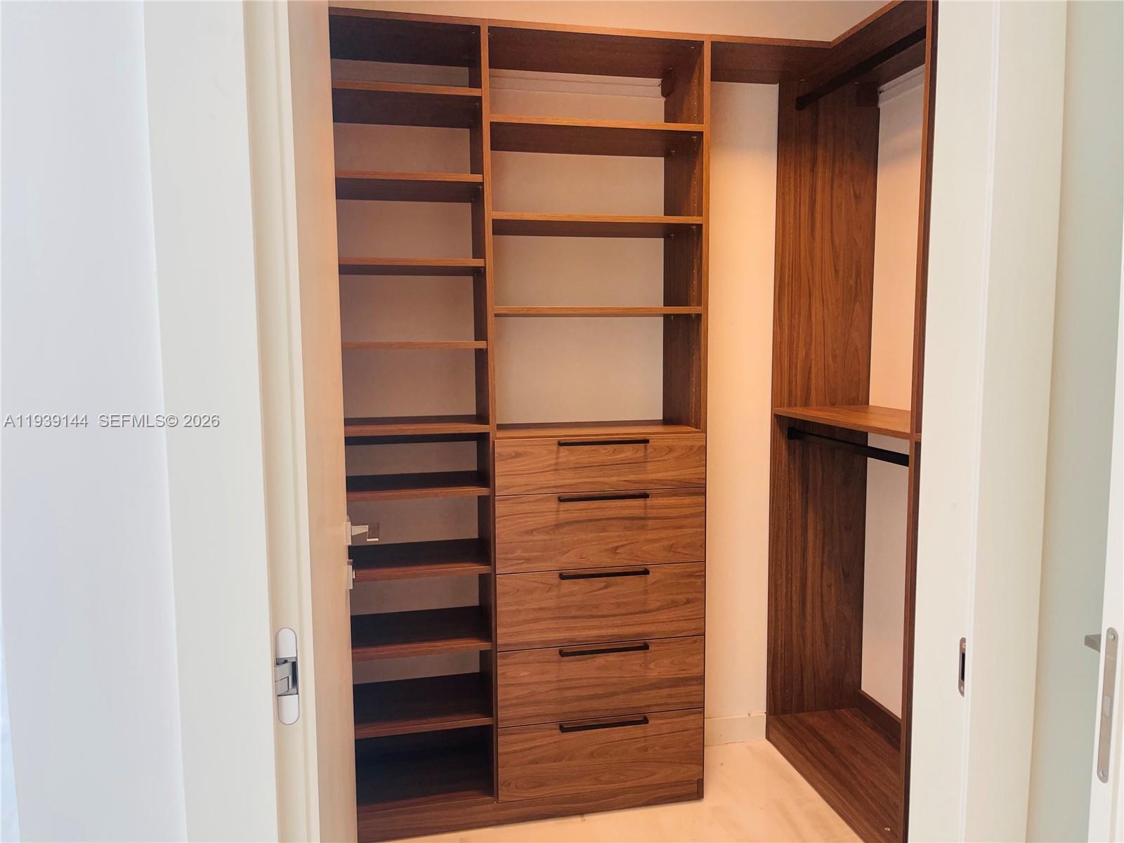 300 Biscayne Blvd Way, Unit 2807 Miami, FL 33131 - Photo 37 of 59 a view of walk in closet with empty racks