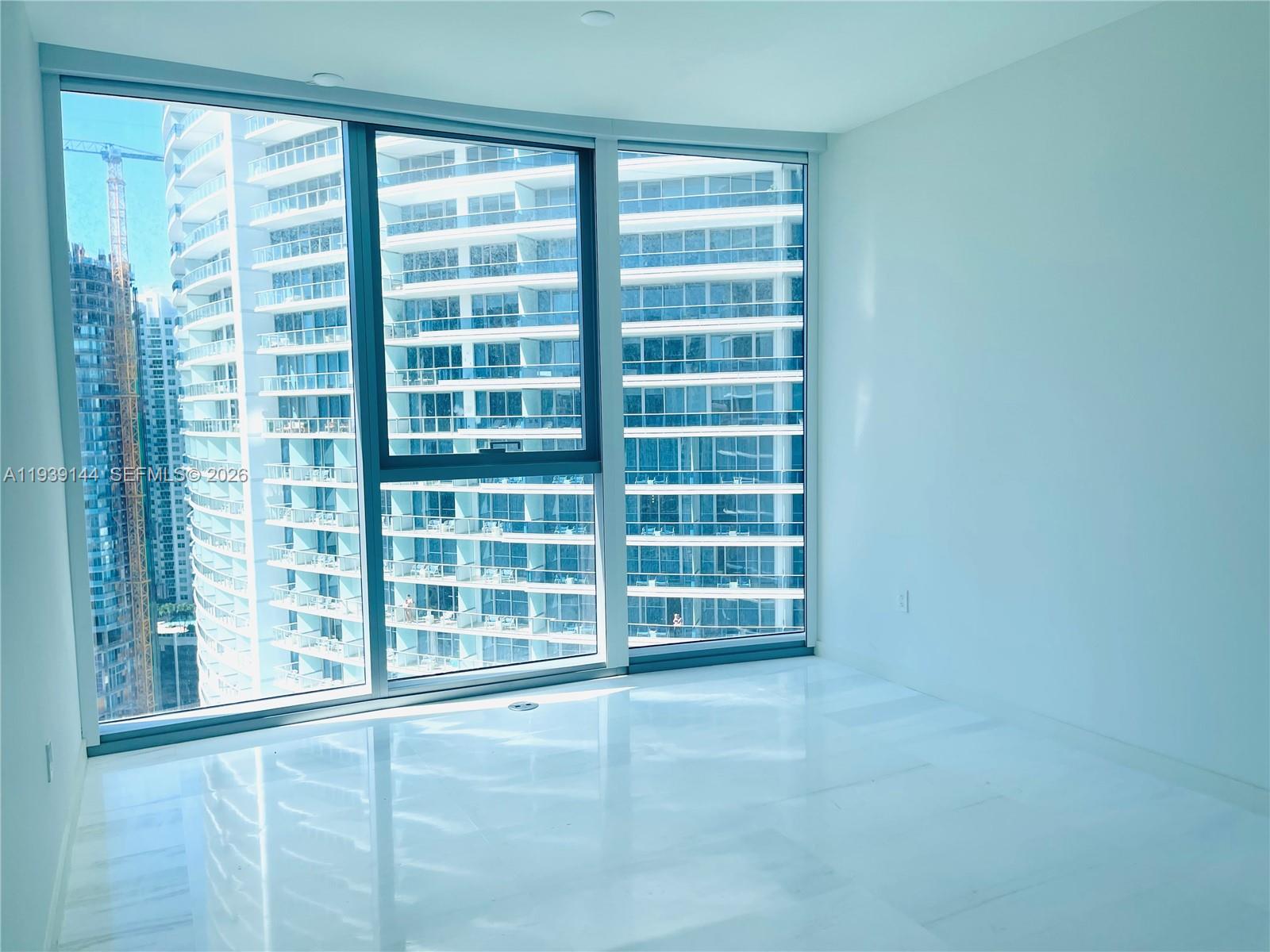 300 Biscayne Blvd Way, Unit 2807 Miami, FL 33131 - Photo 48 of 59 a view of an empty room with a window