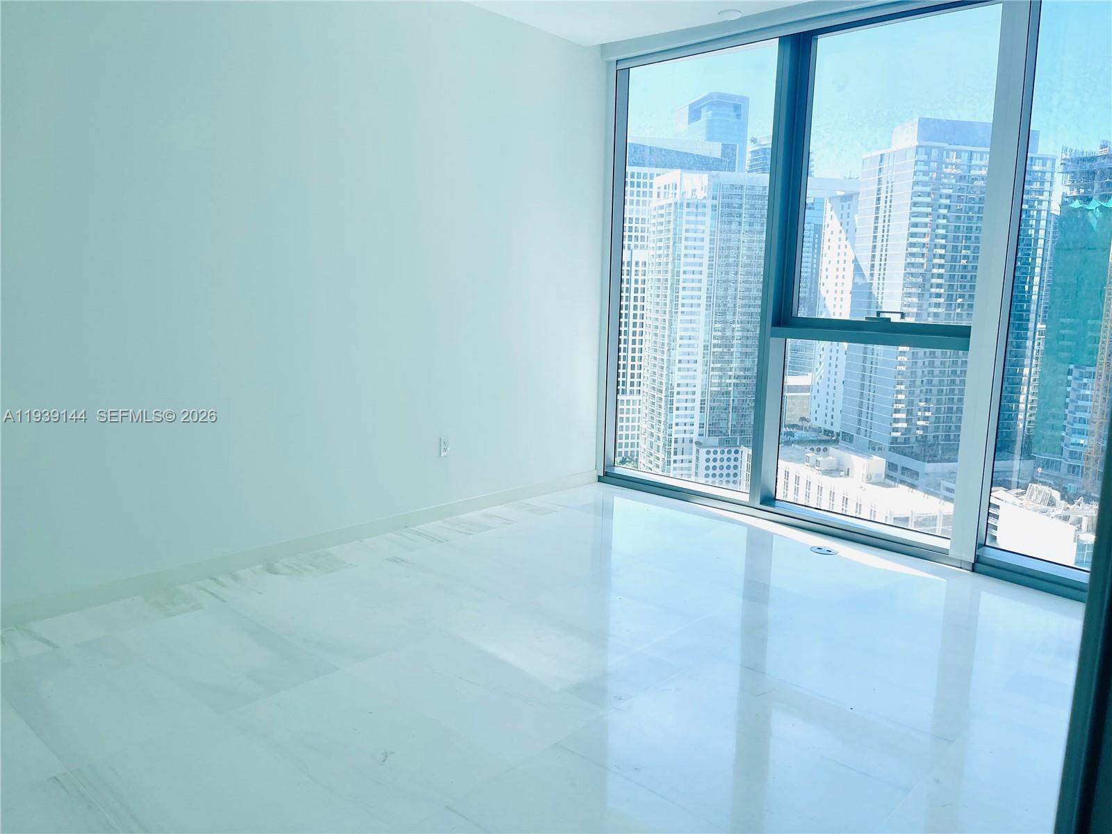 300 Biscayne Blvd Way, Unit 2807 Miami, FL 33131 - Photo 50 of 59 a view of an empty room with glass door