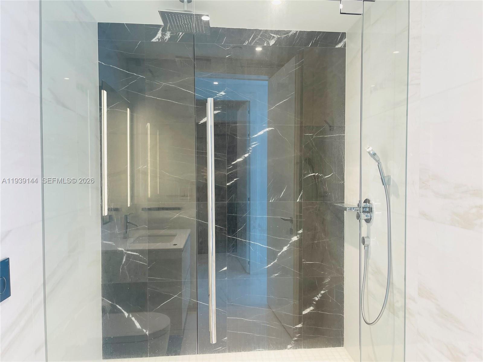 300 Biscayne Blvd Way, Unit 2807 Miami, FL 33131 - Photo 54 of 59 a bathroom with a glass shower door