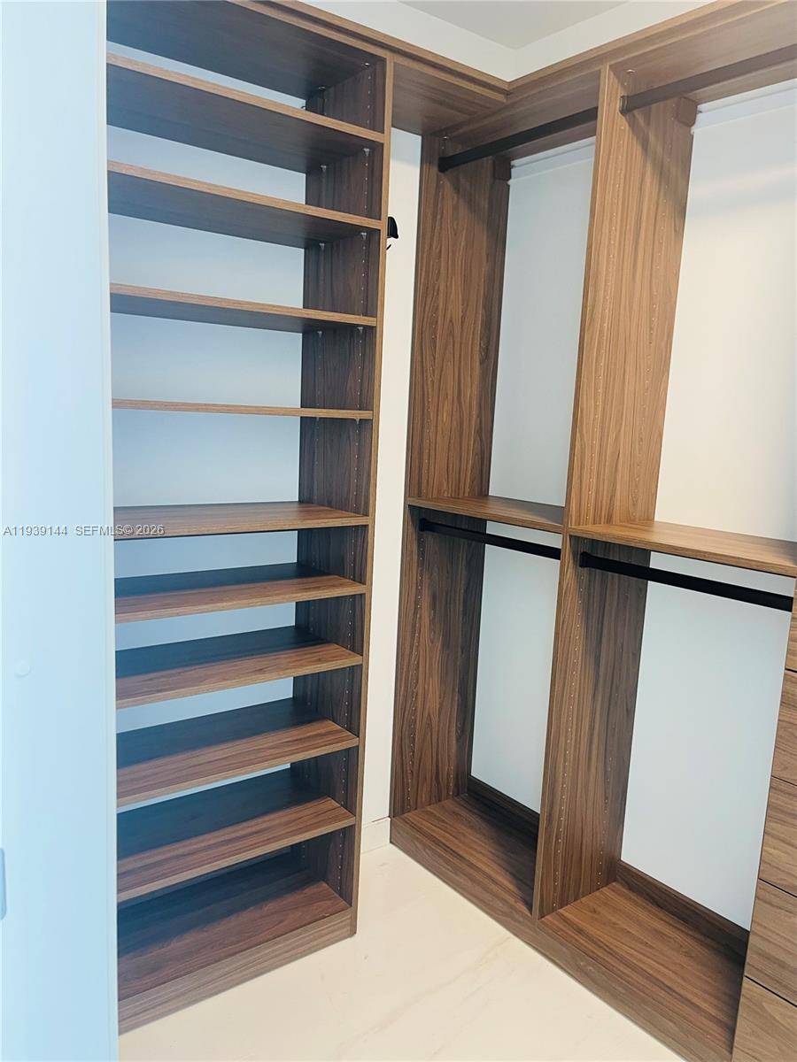 300 Biscayne Blvd Way, Unit 2807 Miami, FL 33131 - Photo 59 of 59 a view of walk in closet with empty racks