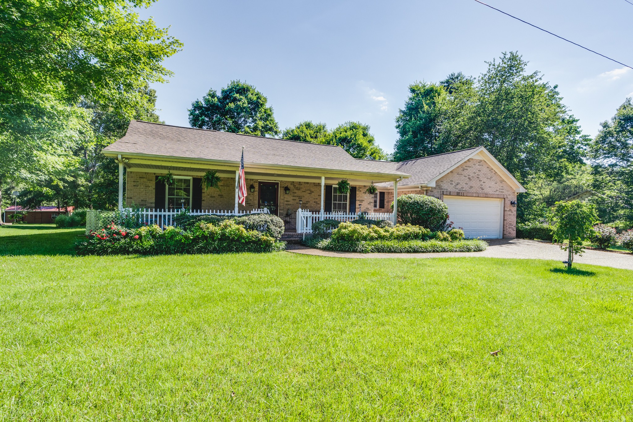 7139 New Hope Road Fairview, TN 37062 - Photo 2 of 41 a front view of a house with a yard and trees