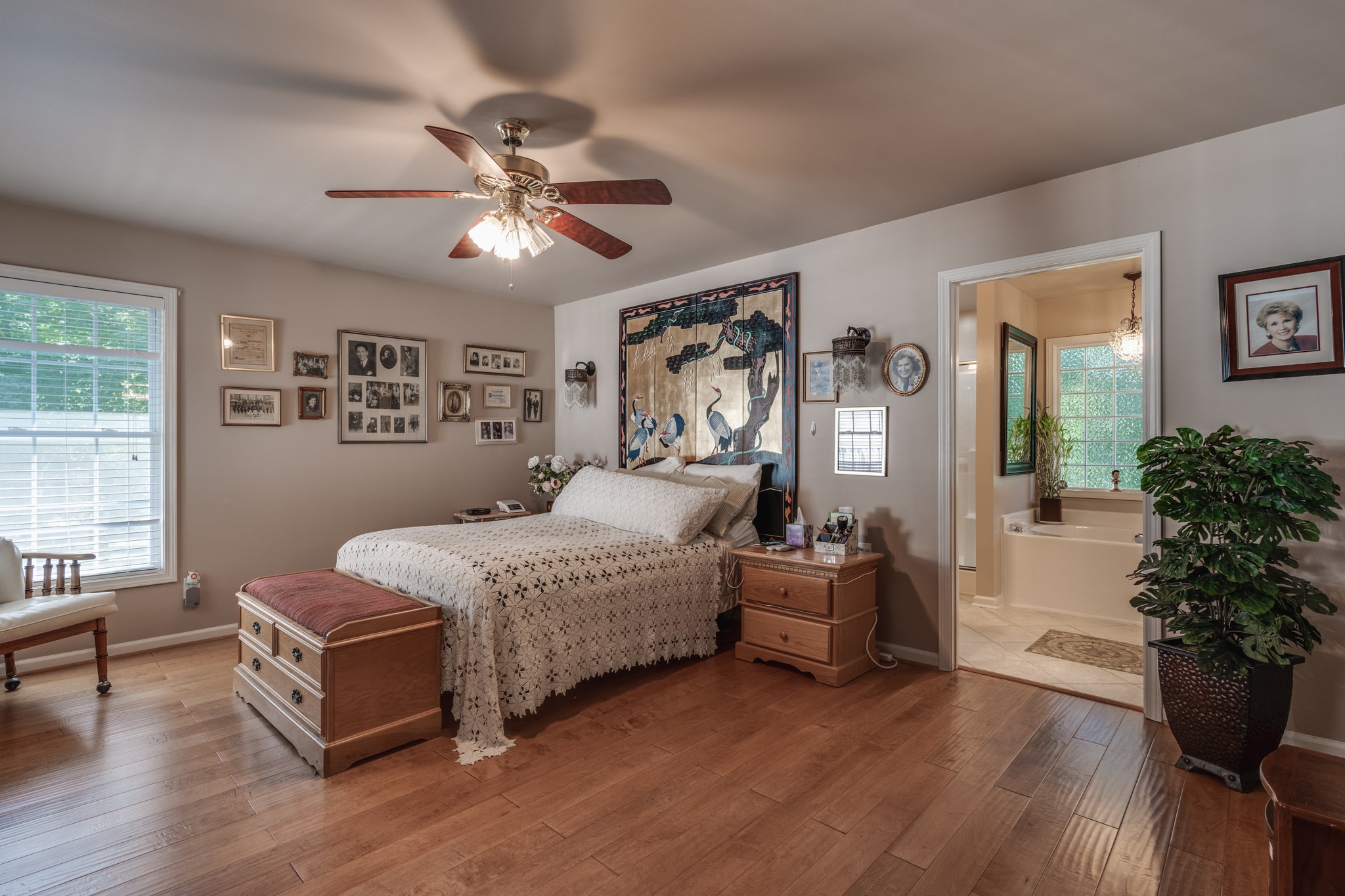 7139 New Hope Road Fairview, TN 37062 - Photo 17 of 41 a spacious bedroom with a bed and a chandelier