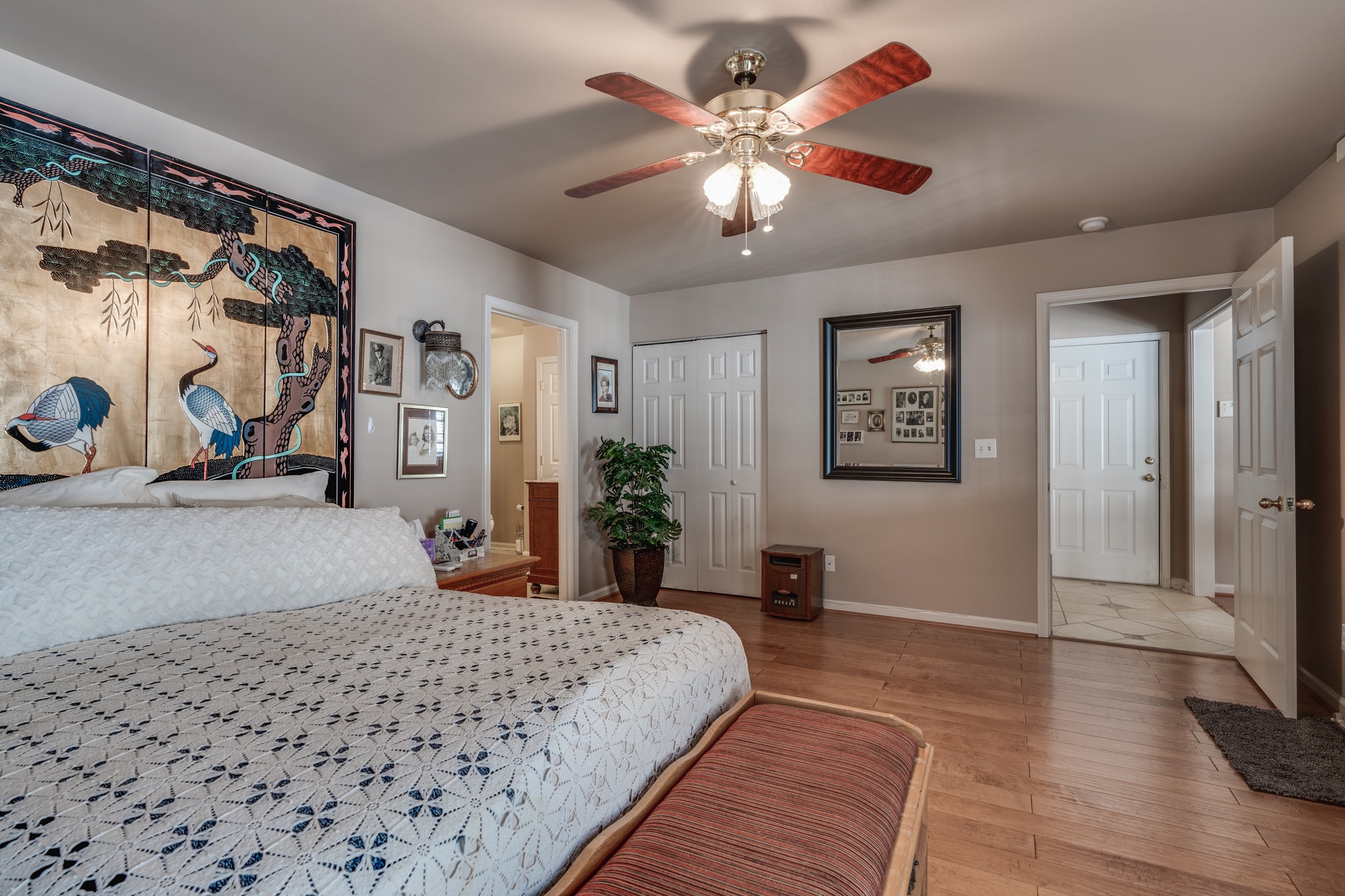7139 New Hope Road Fairview, TN 37062 - Photo 18 of 41 a bedroom with a large bed and a chandelier