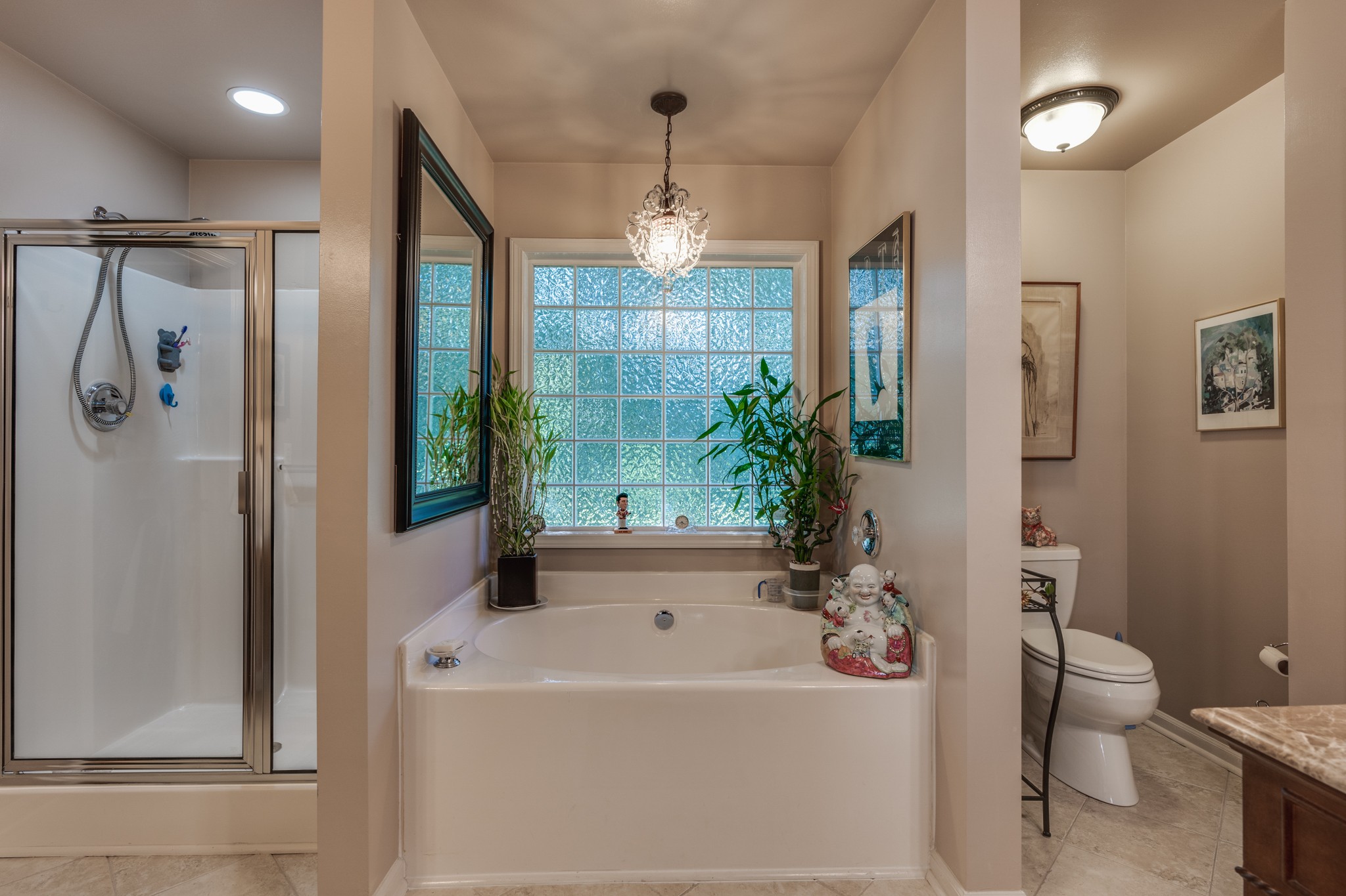 7139 New Hope Road Fairview, TN 37062 - Photo 19 of 41 a white bath tub sitting next to a white toilet and a shower