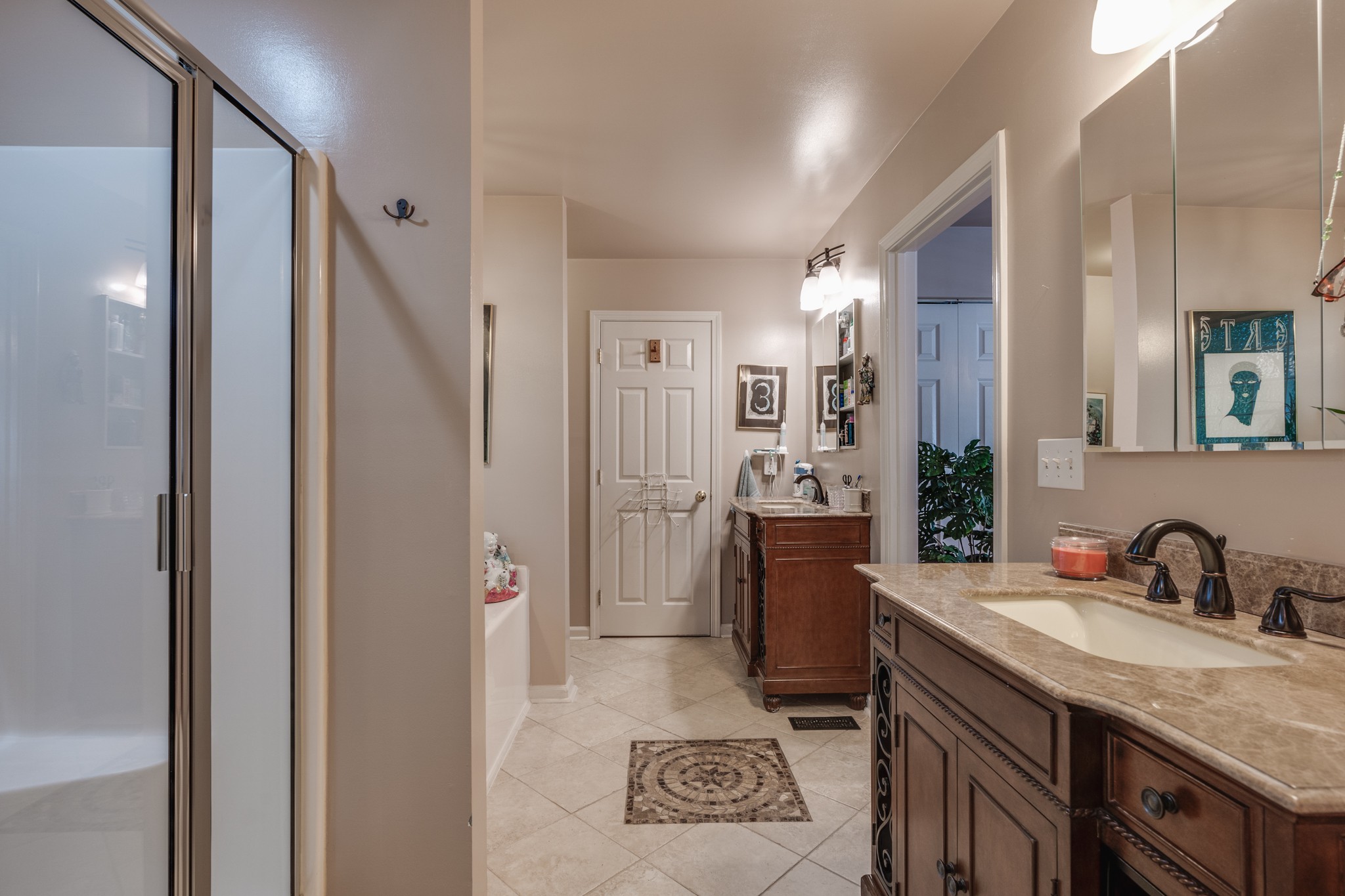 7139 New Hope Road Fairview, TN 37062 - Photo 21 of 41 a spacious bathroom with a granite countertop sink a mirror and shower
