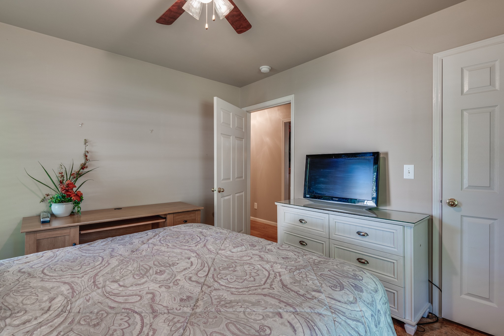 7139 New Hope Road Fairview, TN 37062 - Photo 25 of 41 a bedroom with a bed and a flat screen tv
