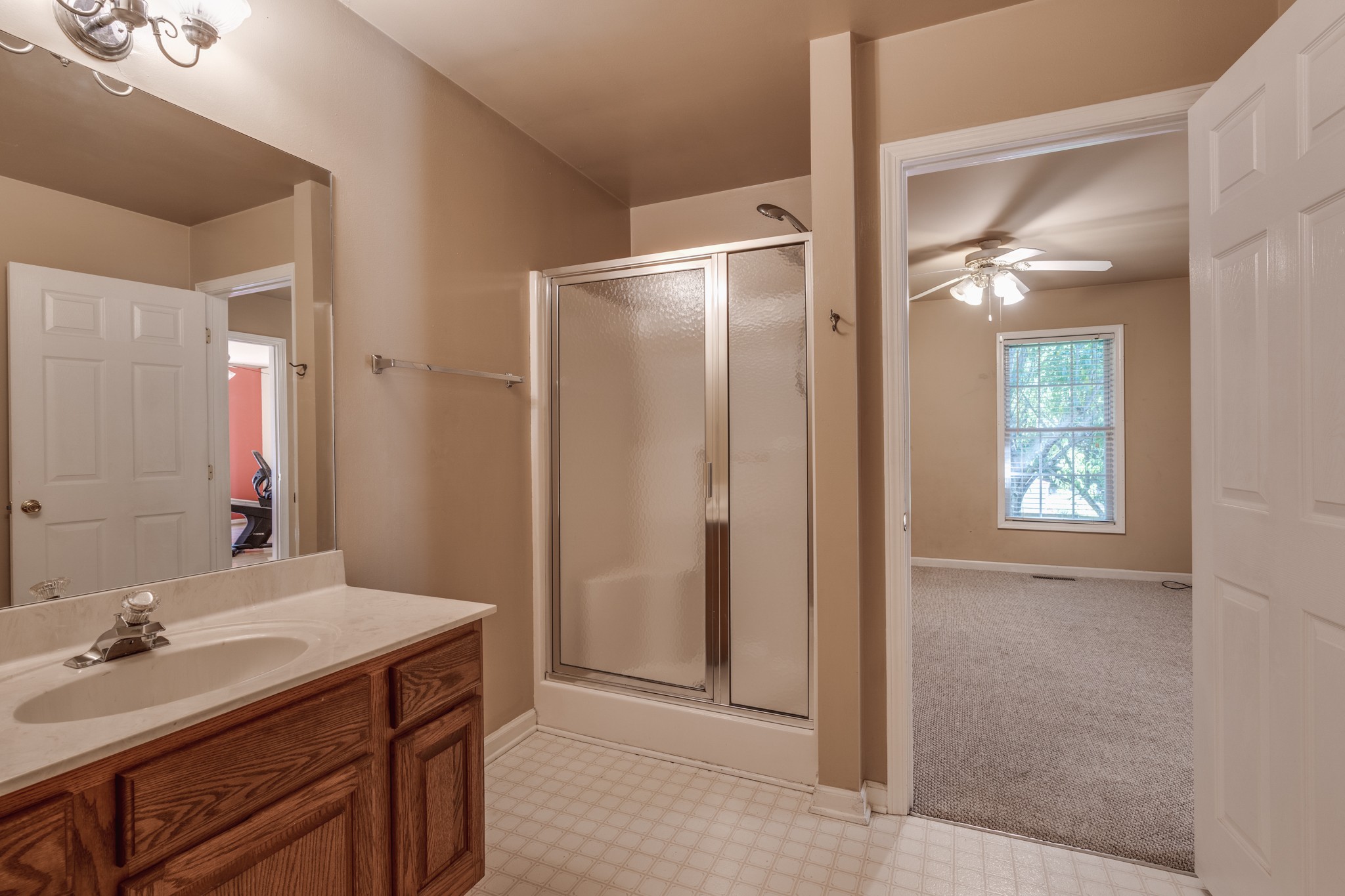 7139 New Hope Road Fairview, TN 37062 - Photo 36 of 41 a bathroom with a double vanity sink a mirror and a shower