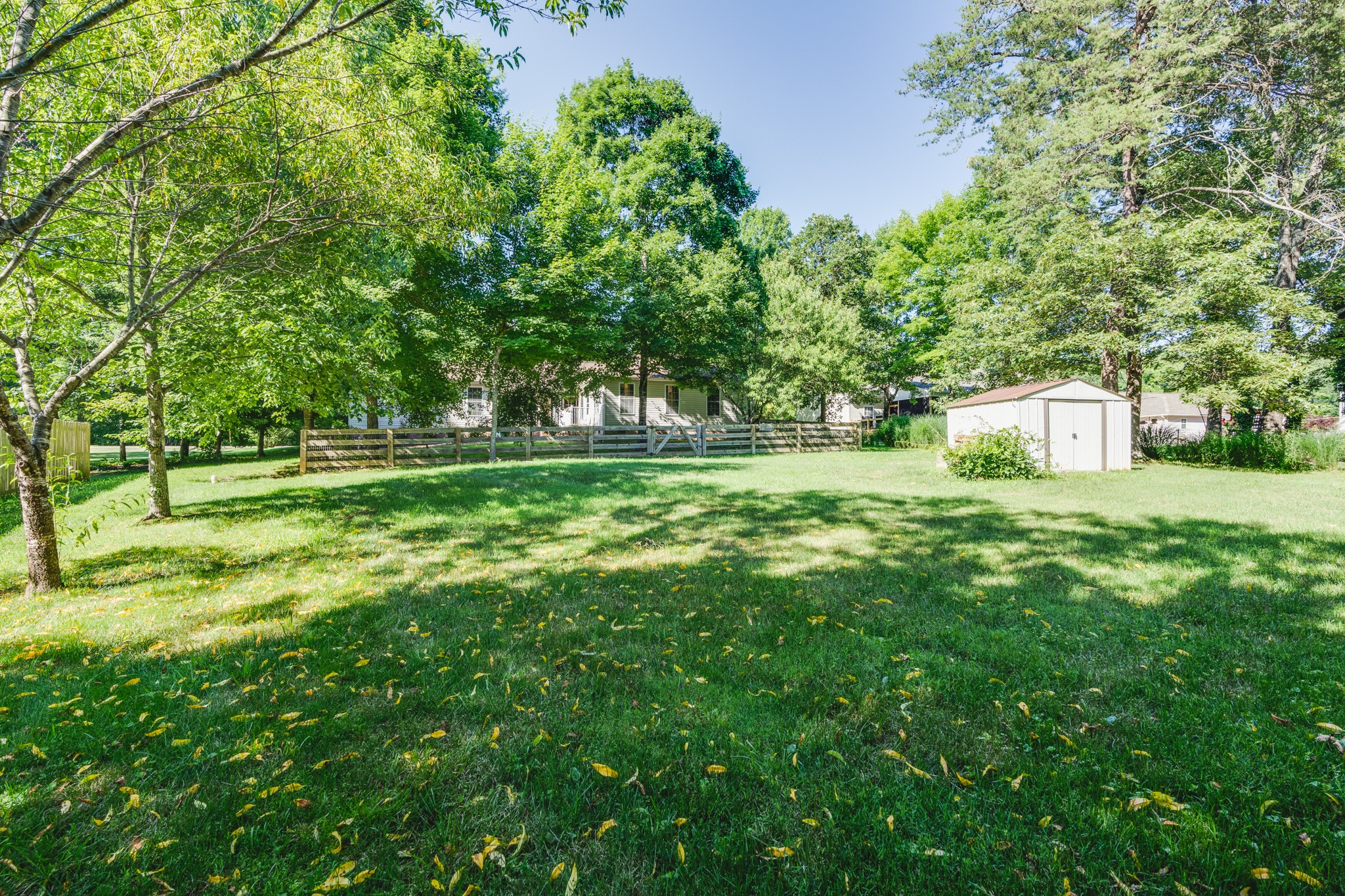 7139 New Hope Road Fairview, TN 37062 - Photo 40 of 41 a backyard of a house with lots of green space and fountain