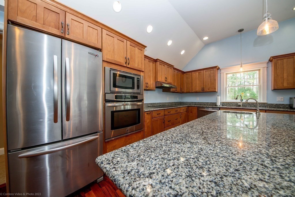 558 County Road Wareham, MA 02576 - Photo 14 of 32 a kitchen with stainless steel appliances granite countertop a refrigerator a stove and a sink with wooden floor