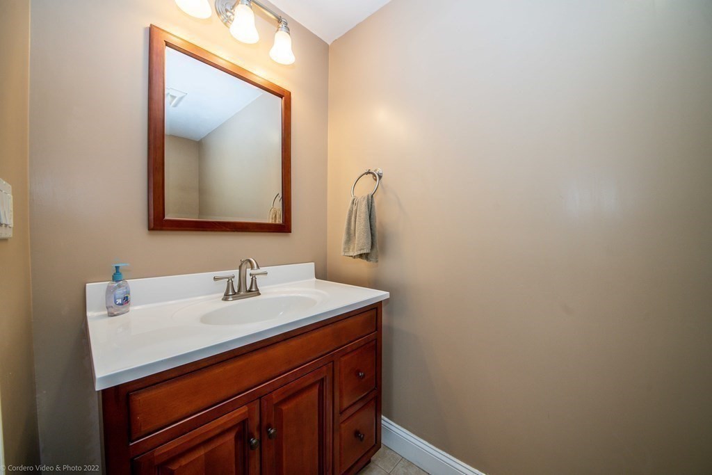 558 County Road Wareham, MA 02576 - Photo 16 of 32 a bathroom with a sink vanity and a mirror