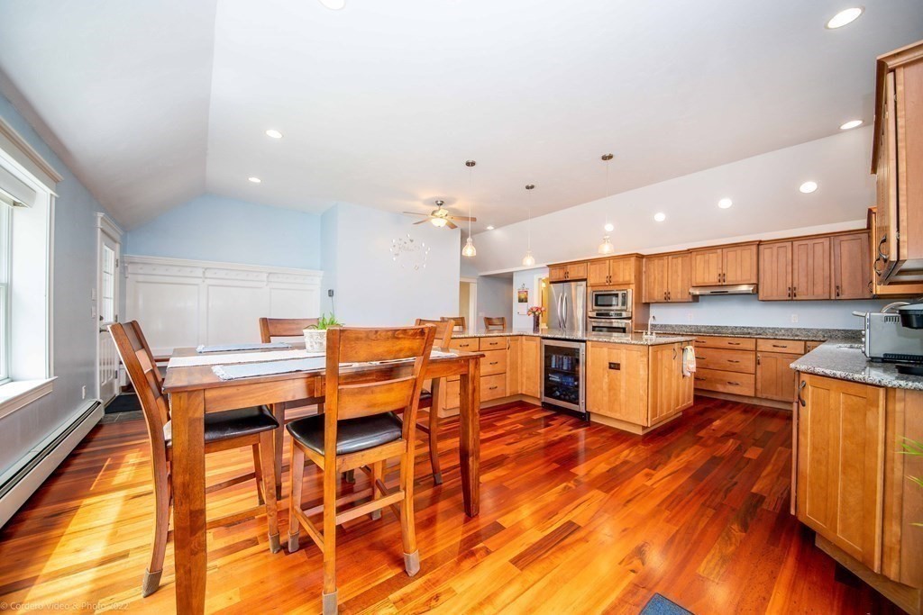 558 County Road Wareham, MA 02576 - Photo 4 of 32 an open kitchen with kitchen island wooden floors and center island