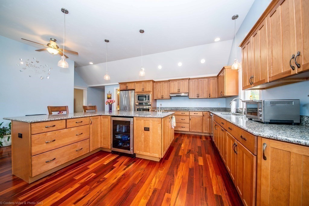 558 County Road Wareham, MA 02576 - Photo 6 of 32 a large kitchen with stainless steel appliances granite countertop a lot of counter space and wooden floors