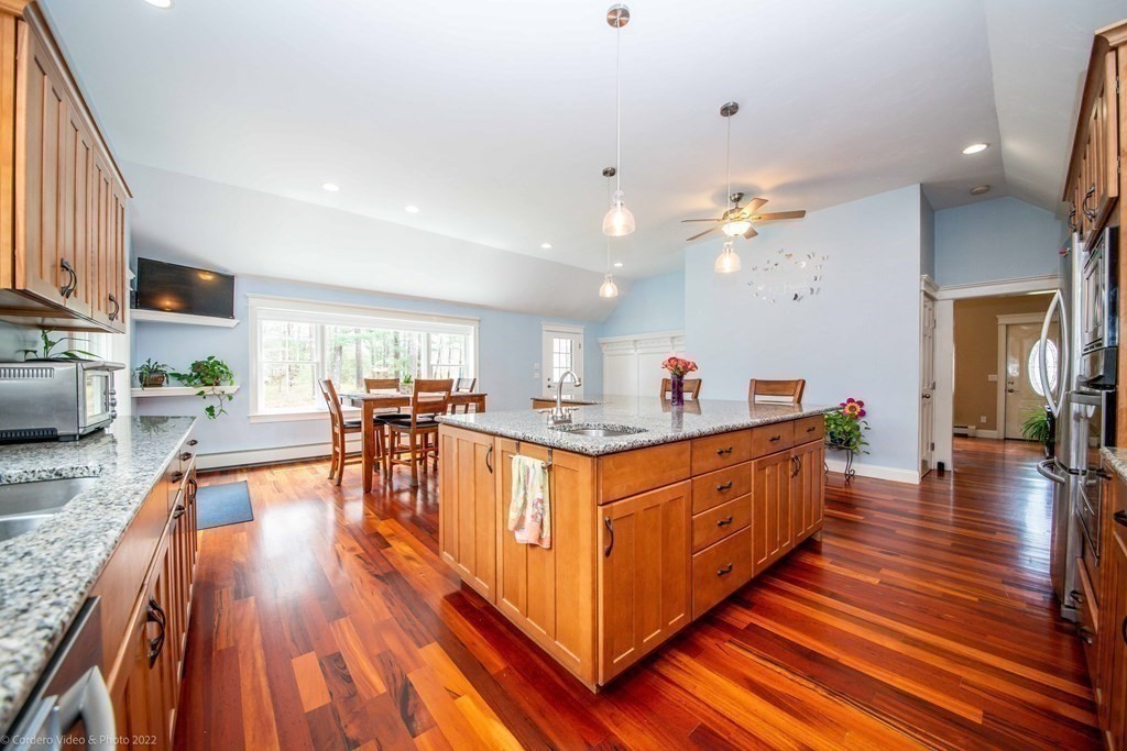 558 County Road Wareham, MA 02576 - Photo 7 of 32 a large kitchen with lots of counter top space and wooden floor