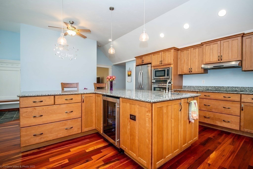 558 County Road Wareham, MA 02576 - Photo 10 of 32 a kitchen with granite countertop a sink cabinets stainless steel appliances and wooden floor