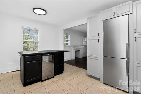 a kitchen with stainless steel appliances granite countertop a stove a refrigerator and a sink