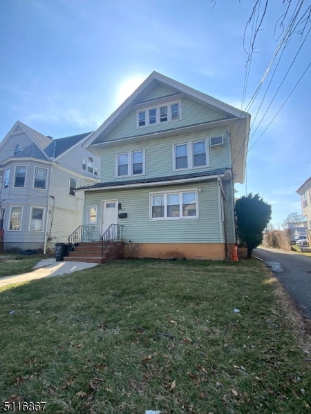 134 Murray Street Elizabeth, NJ 07202 - Photo 1 of 1 a front view of a house with a yard