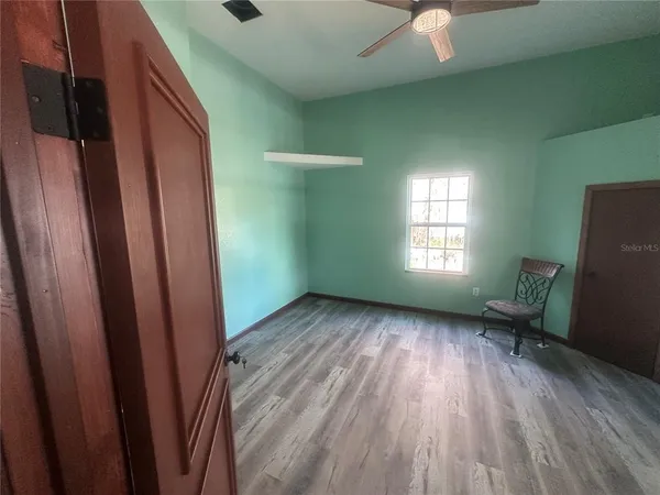 a view of a room that has a window in it