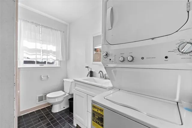 a bathroom with a sink a toilet and a vanity