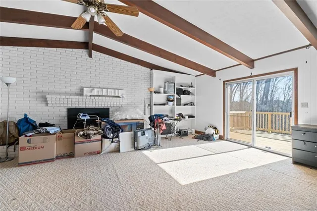 a bedroom with furniture and a fireplace