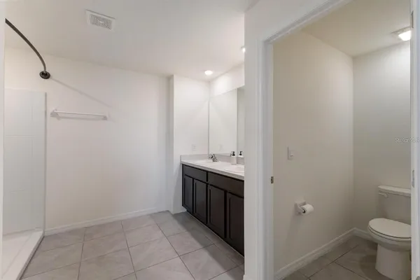 a view of bathroom with a sink and toilet