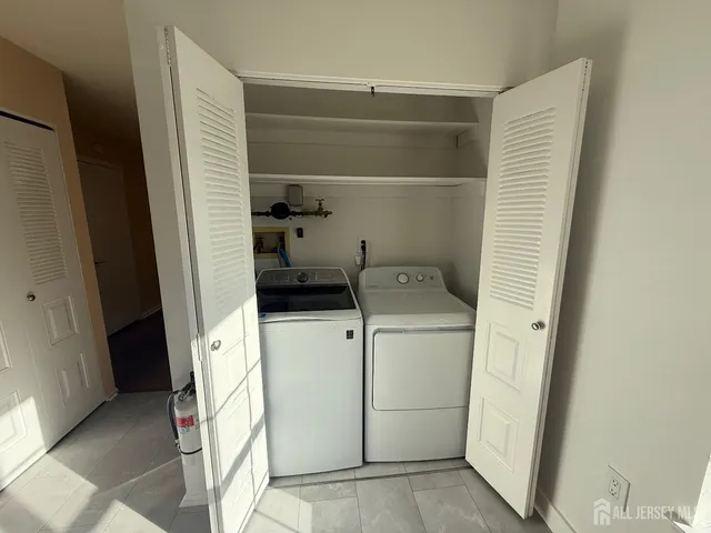 a utility room with dryer and washer