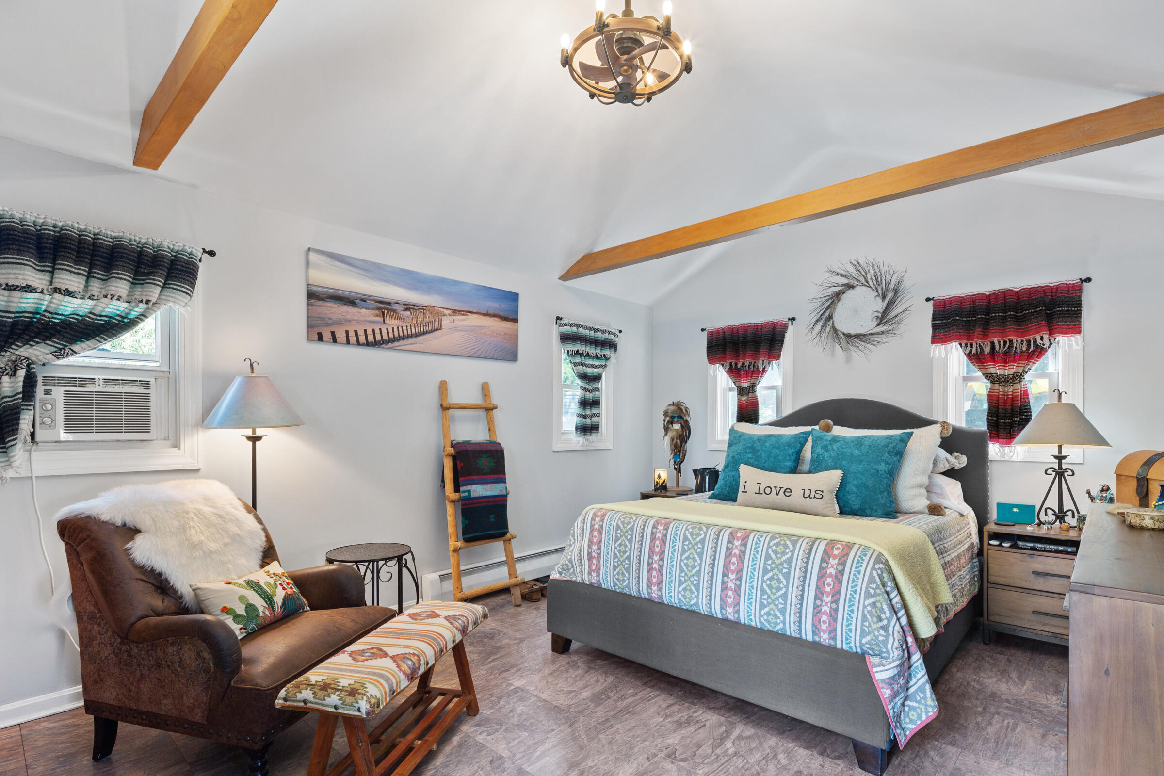 31 Soundview Road Centerville, MA 02632 - Photo 15 of 50 a bedroom with a bed and a chandelier