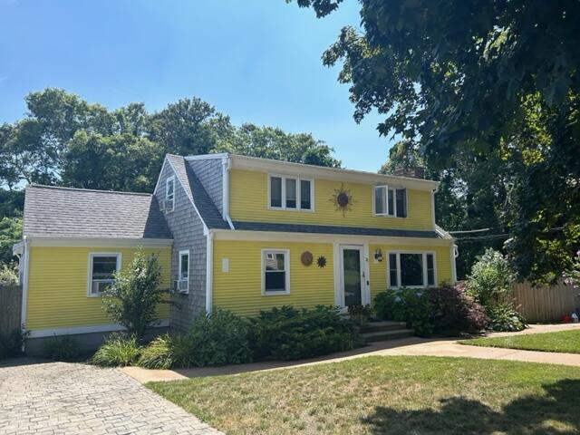 31 Soundview Road Centerville, MA 02632 - Photo 2 of 50 a front view of a house with a yard and trees