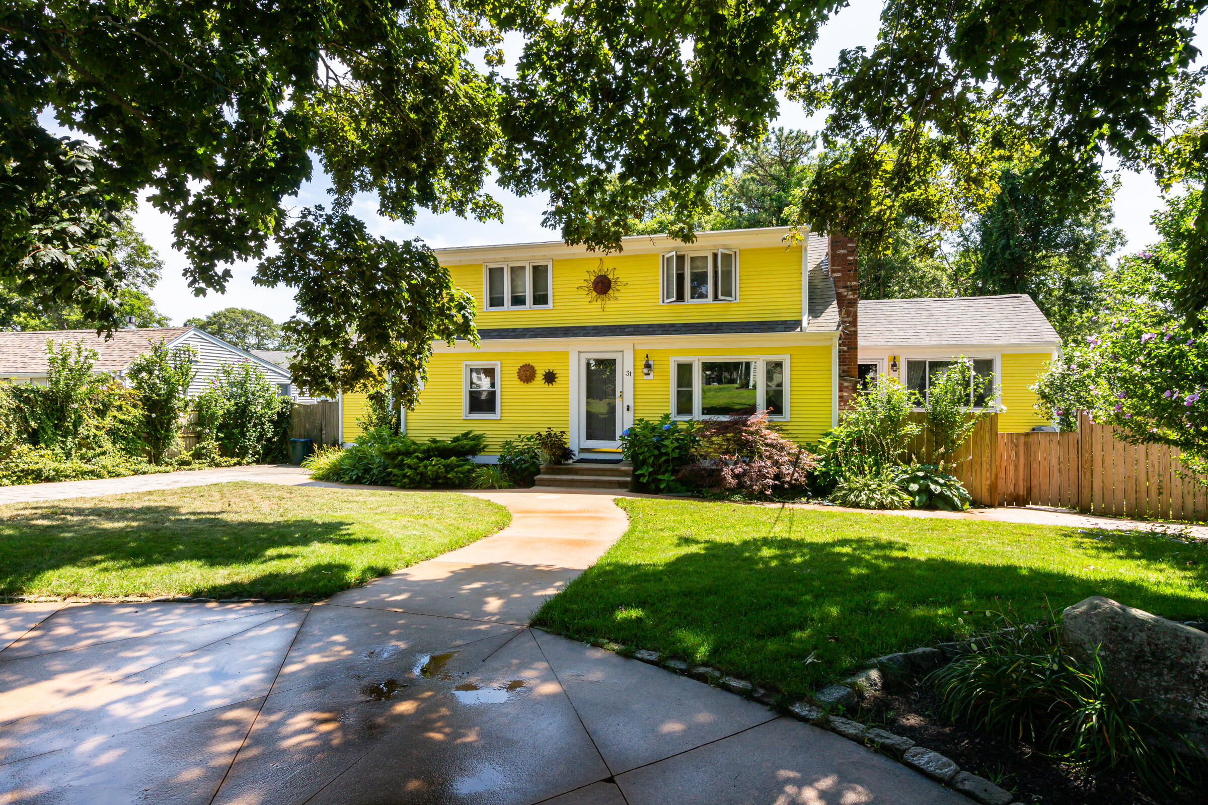 31 Soundview Road Centerville, MA 02632 - Photo 33 of 50 a front view of a house with a yard and trees