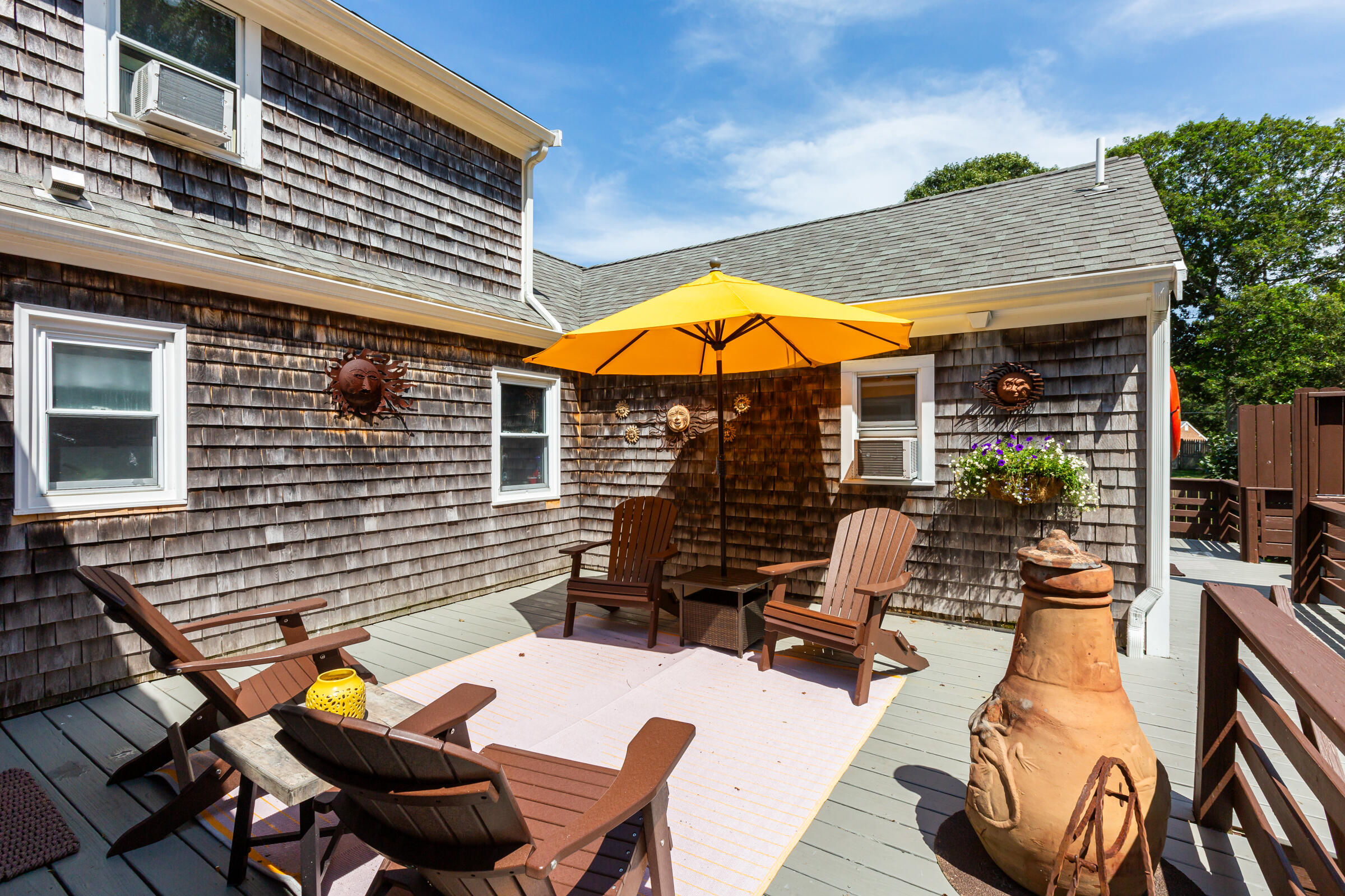 31 Soundview Road Centerville, MA 02632 - Photo 40 of 50 a view of a patio with chairs and tables