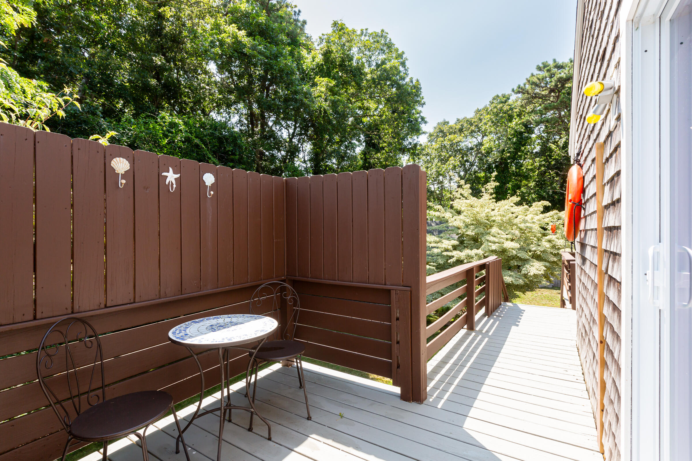 31 Soundview Road Centerville, MA 02632 - Photo 43 of 50 a backyard of a house with table and chairs