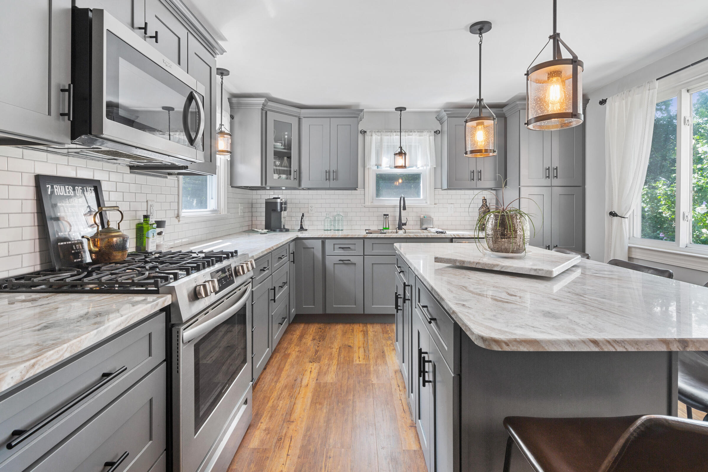 31 Soundview Road Centerville, MA 02632 - Photo 8 of 50 a kitchen with stainless steel appliances granite countertop a stove a sink and a refrigerator