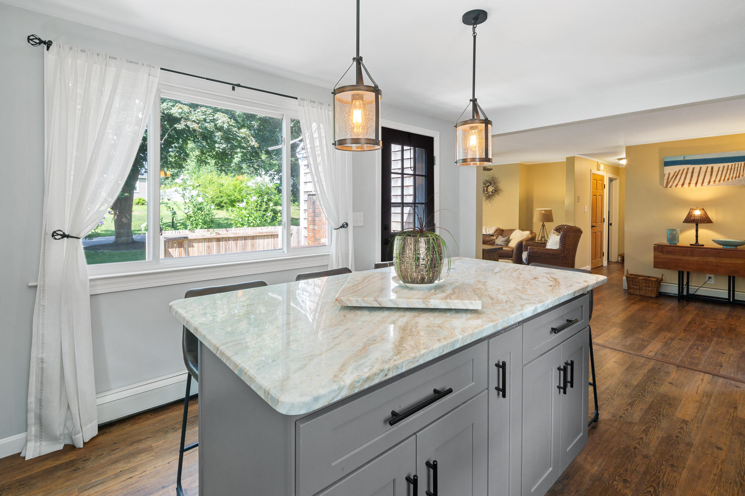 31 Soundview Road Centerville, MA 02632 - Photo 10 of 50 a kitchen with granite countertop sink and wooden floor