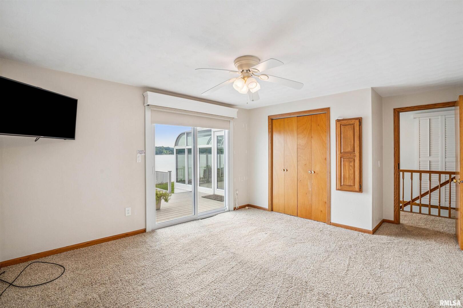 22799 Great River Road Le Claire, IA 52753 - Photo 26 of 48 a view of an empty room with a window