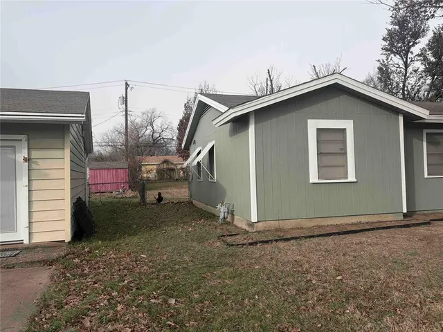 a house with trees in the background